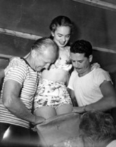 Staff helping Ann Blyth fit into her tail - Weeki Wachee Spring, Florida.