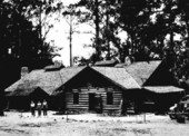 Forestry training camp boys and dignitaries outside the mess hall