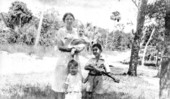 Mrs. I. A. Krusen holding Christine with brothers standing in front
