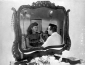 Rick Hollister doing on-location interview with singer, movie actress and burlesque star Ann Corio