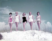Unidentified young women modeling on a sand dune at the beach - Panama City, Florida.