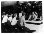 Customers waiting at the counter for soda inside the Suwannee Drug Company - Newberry, Florida