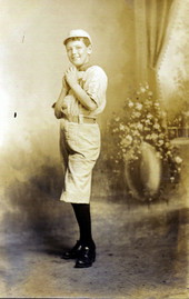 Boy posing in baseball uniform