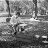 Seminole Indian Josie Billie sitting in chair looking at a Wheel of Life