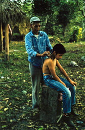 Seminole Indian barber working at the Big Cypress Seminole Indian Reservation