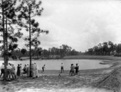 View showing golf being played on the Miami Biltmore Hotel and Country Club golf course in Coral Gables, Florida.
