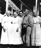 Five family members in the rear of the English home