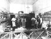 Men working in the Duval Shoe Hospital - Gainesville, Florida.