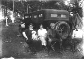 Two men, two women and a poodle