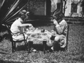Blanche and Mary Pat Weedon playing tea party