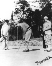 Couple with caddy on the course