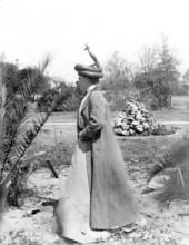 Lady with stuffed rattlesnake hat on head.