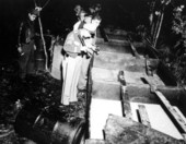 Sheriffs with distillery equipment.