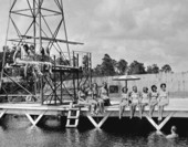 Mermaids on diving tower and dock at Weeki Wachee Spring.