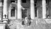 Women standing on the steps of Florida's Capitol building.