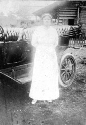Lily Futch standing next to a car