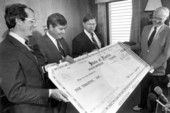 Governor Bob Graham and legislators present check for $4 million .