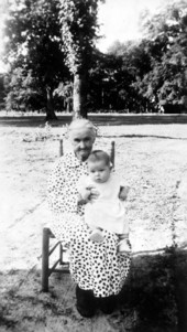 Lizzy Byrd Carroway with an infant on her lap