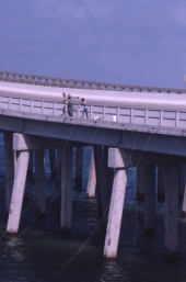 People crabbing in the East Pass channel from bridge - Destin, Florida