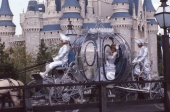 Cinderella in her coach on parade in front of the castle - Walt Disney World, Florida.