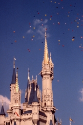 Balloons flying high above Cinderella's castle - Walt Disney World, Florida.