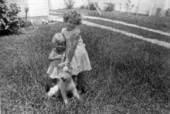 Sisters Judy and Susan Becker with their dog - Miami Beach, Florida.