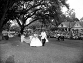 May Day king and queen walking through Lewis Park - Tallahassee, Florida.