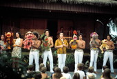 Children watch puppets and performers at the Polynesian Luau - Orlando, Florida .