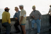 Men stand at the South Beach Pier - Miami, Florida