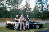 Troopers stand in front of a Chevy Camaro especially equipped for law enforcement