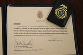 Oath of Office certificate and badge for Special Agent Alfred E. McNeill, Jr. from the Florida Department of Law Enforcement