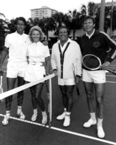 Comedian Alan King, third from the left, gathered with other players by the net for a group portrait on the tennis court - Fort Lauderdale, Florida.