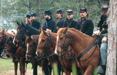 View of cavalry battle reenactors at the Olustee Battlefield Historic State Park festival - Baker County, Florida.