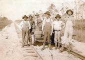 G.F. & A. Railroad employees standing next to a railway cart near Sopchoppy, Florida.