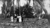 Women of the Kaszer family walking along path near residence in Auburndale, Florida.