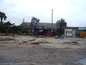 View showing The Hut Restaurant at W. Hwy 98 damaged by Hurricane Dennis - Apalachicola, Florida.
