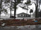 Flooding of Davis Seafood with debris during Hurricane Dennis in Apalachicola, Florida.