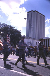 View showing KKK members marching north on South Monroe Street during a rally in front of the Capitol building - Tallahassee, Florida.