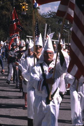 Close-up view showing KKK members during their marching rally on South Monroe Street in Tallahassee, Florida.