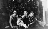 LeRoy Collins and his family in front of a Christmas tree.