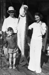 LeRoy Collins,his wife,and son with a fish.