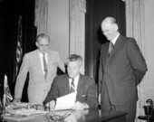 Florida Governor LeRoy Collins signing paperwork