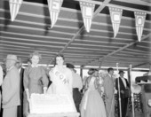 Women holding a cake