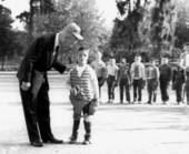 Florida Governor Farris Bryant talking with a young baseball catcher
