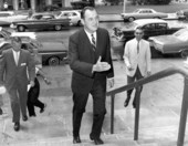 Florida Governor Claude Kirk walking up steps.