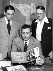 Florida Senator LeRoy Collins reading a campaign guide
