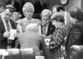 Florida legislators holding a meeting.