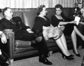 Florida Superintendent of Public Instruction Thomas Bailey and two women on couch.