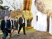 Members of the House Tourism Committee walking with Secretary of State Glenda Hood by historic buildings at the San Luis Mission - Tallahassee, Florida.