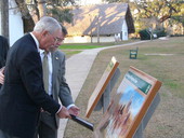 Florida State Representative Don Davis (left) and Director of Legislative Affairs Rivers H. Buford III reading display board at the San Luis Mission.